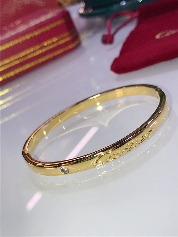 Side view of Cartier unisex jewelry piece