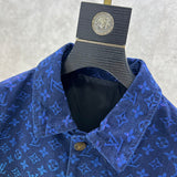Close-up detail shot of Louis Vuitton luxury clothing with label-forward styling