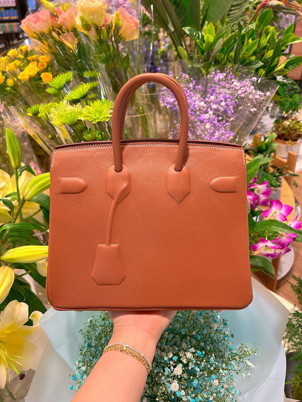 Side view of minimalist structured handbag