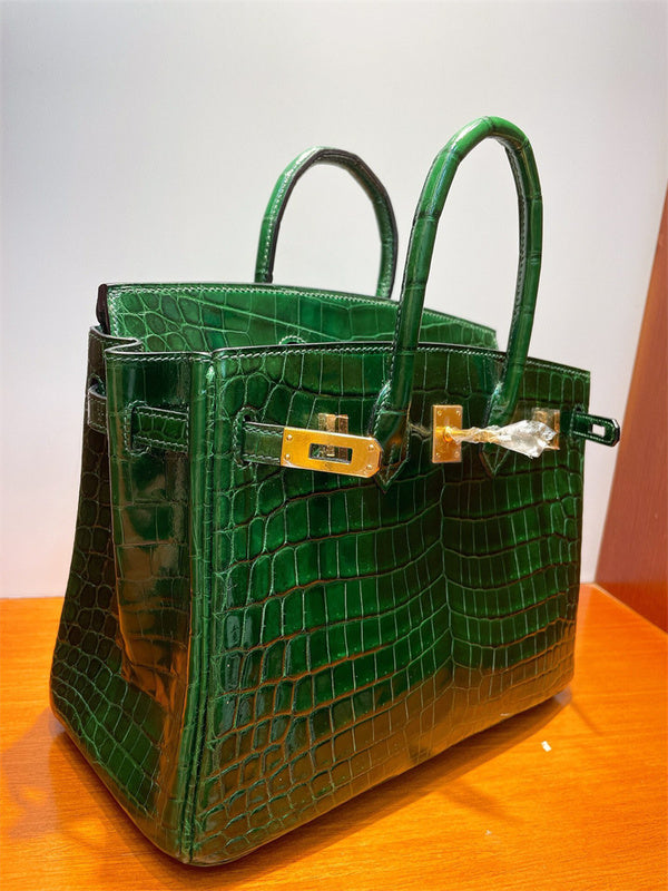  Modern top-handle bag carried on shoulder