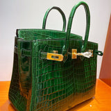  Modern top-handle bag carried on shoulder