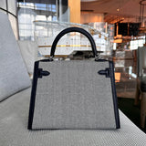  Signature crossbody bag carried on shoulder 10