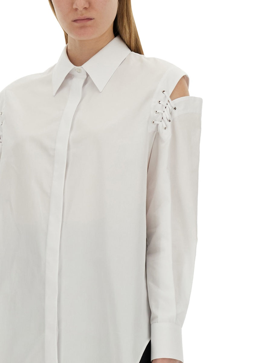Close-up of Alexander McQueen tee shirts hardware and fine stitching