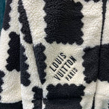 Front view of Louis Vuitton luxury clothing with signature branding