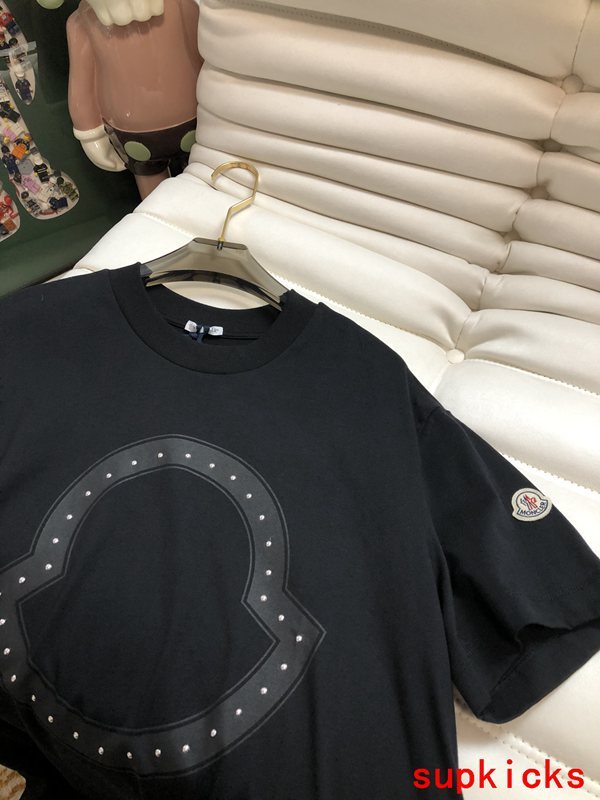 Close-up detail shot of Moncler luxury clothing with monogram-inspired silhouette