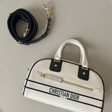 Side profile of signature everyday-luxe women's handbag – women's designer-style accessory