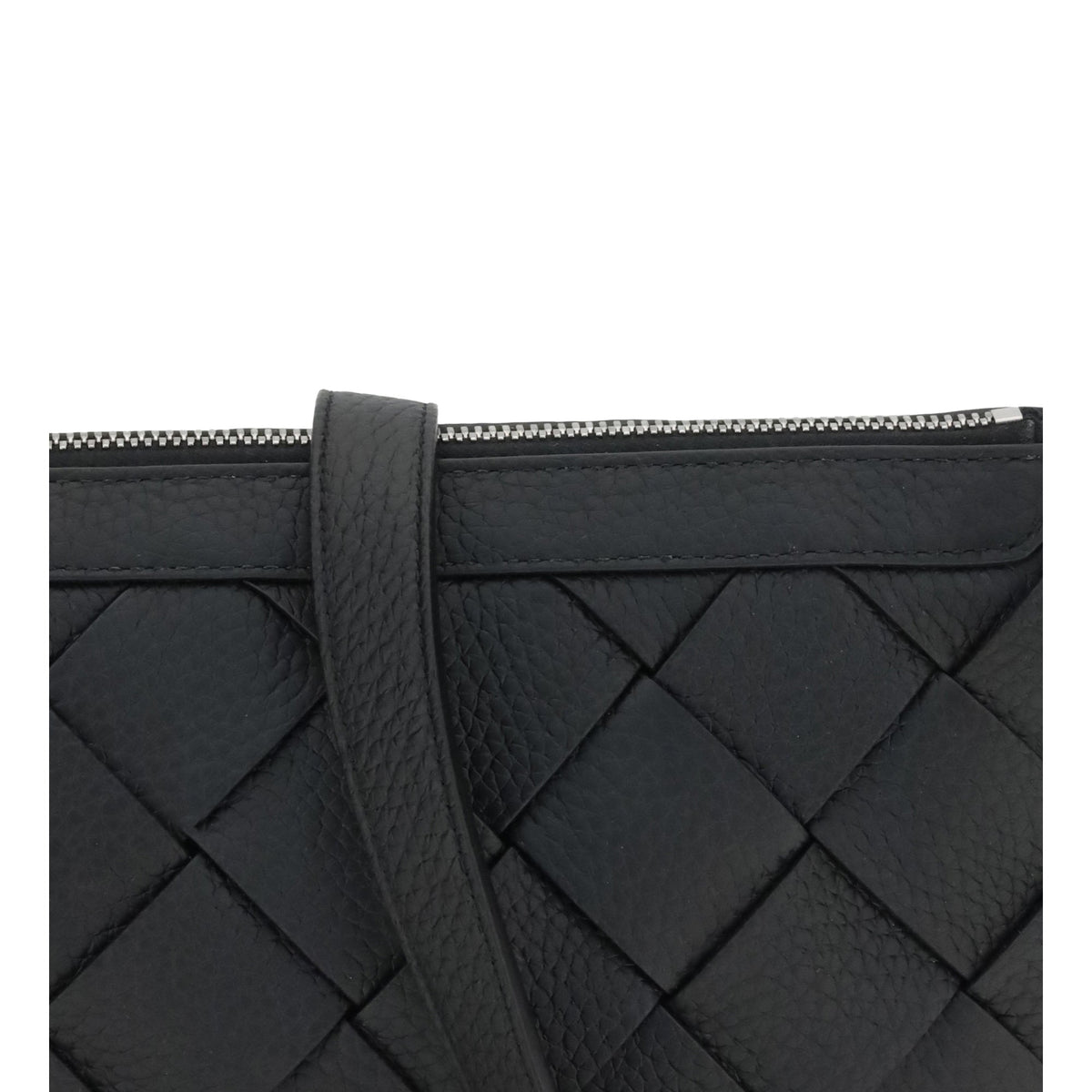 Close-up of Bottega Veneta cross body bags hardware and fine stitching