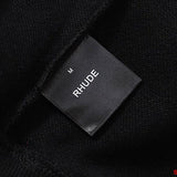 Back view of Rhude luxury clothing with signature branding
