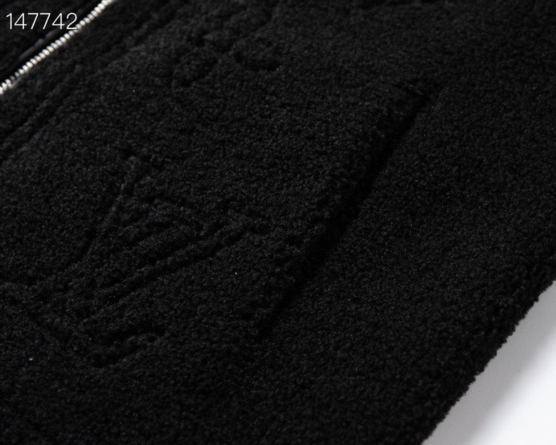 Close-up detail shot of Louis Vuitton luxury clothing with signature branding