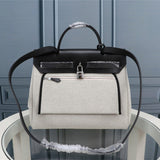 Side view of minimalist structured handbag