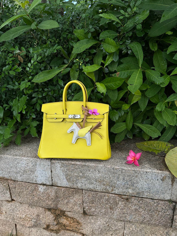 Side view of fluid structured handbag