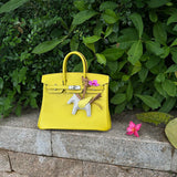 Side view of fluid structured handbag