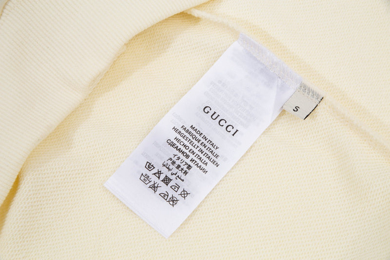 Close-up detail shot of Gucci luxury clothing with relaxed-fit cut