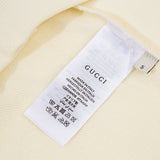 Close-up detail shot of Gucci luxury clothing with relaxed-fit cut