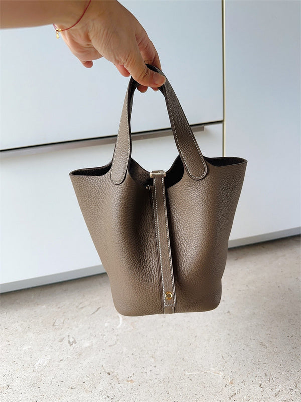  Structured crossbody bag carried on shoulder 16