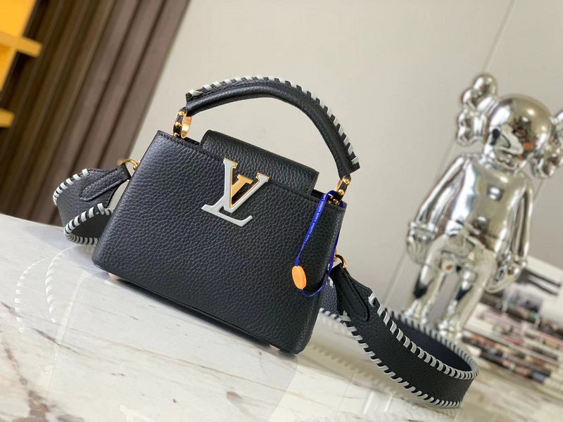 Side profile of polished structured women's handbag – women's luxury accessory