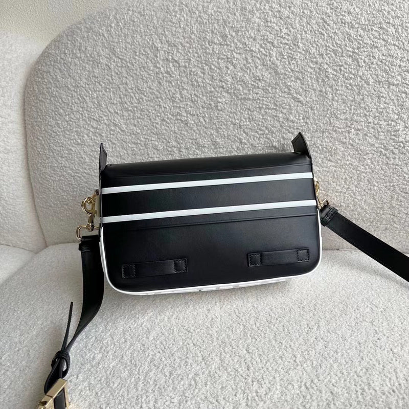 Close-up detail of sleek everyday-luxe women's handbag – women's designer-style accessory