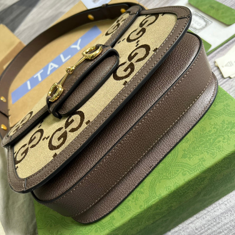 Styled lifestyle shot of polished classic women's handbag – women's statement bag