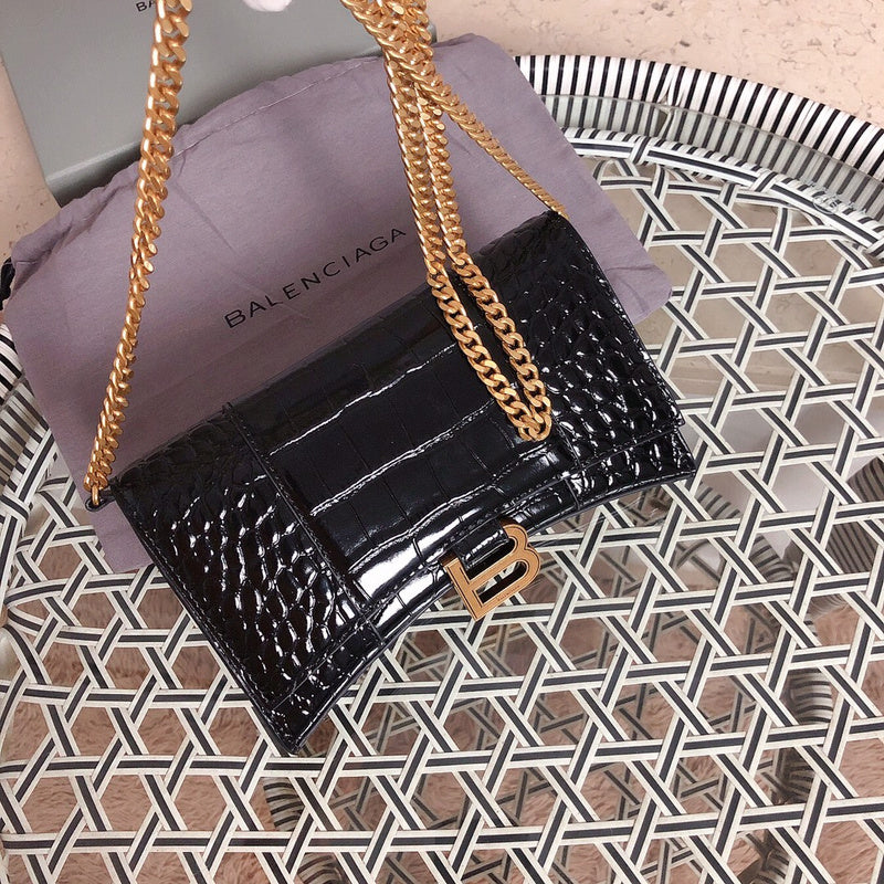Styled lifestyle shot of sleek polished women's handbag – women's luxury handbag