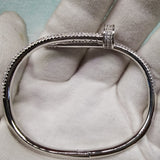 Side view of Cartier unisex jewelry piece
