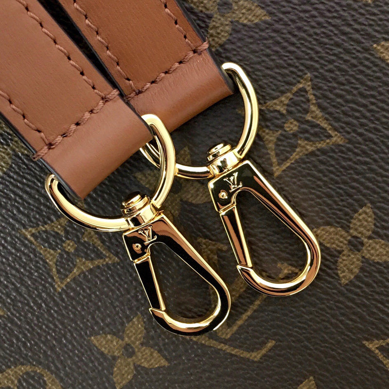 Handle and strap detail of modern signature women's handbag – women's designer-style accessory