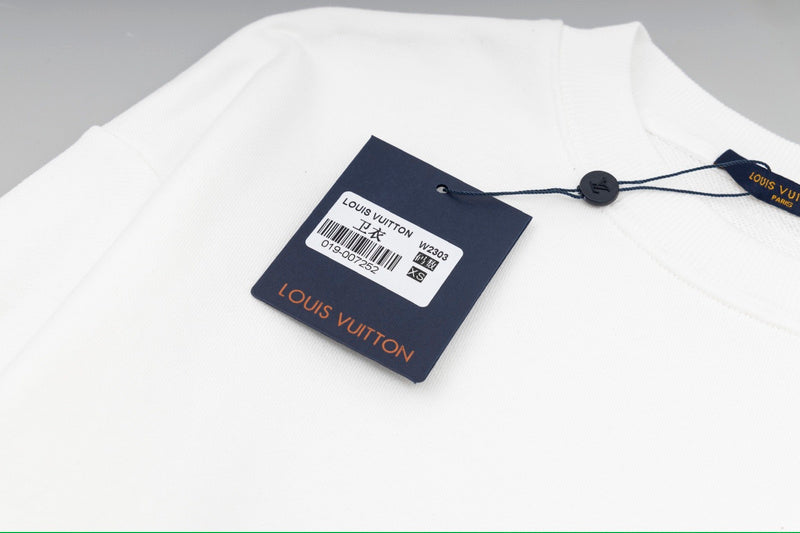 Flat lay presentation of Louis Vuitton luxury clothing with everyday silhouette
