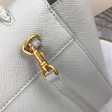 Styled lifestyle shot of signature statement women's handbag – women's everyday handbag