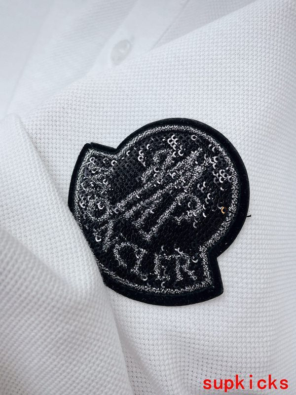 Front view of Moncler luxury clothing with logo-detail design