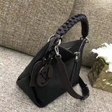 Close-up detail of polished sleek women's handbag – women's luxury accessory