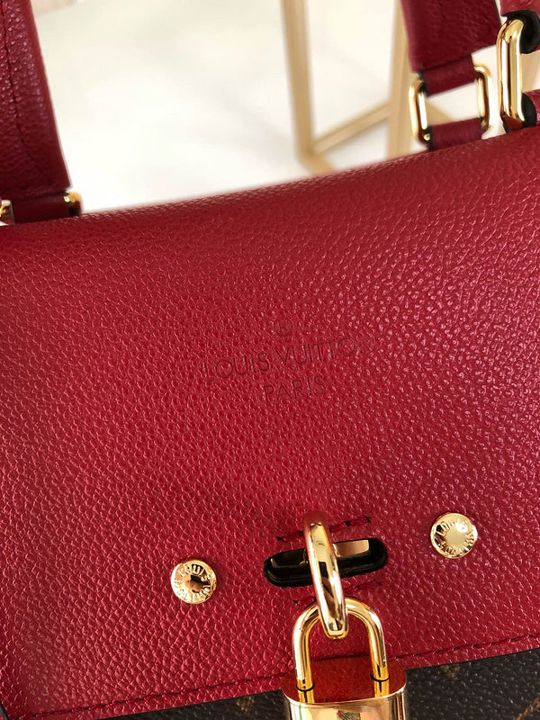 Back view of classic elevated women's handbag – women's statement bag