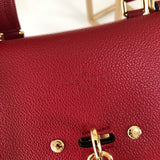 Back view of classic elevated women's handbag – women's statement bag