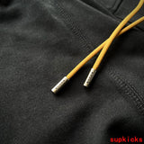Side profile of Rhude luxury clothing with everyday silhouette
