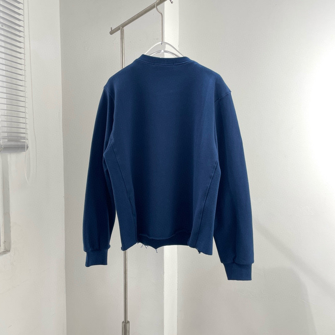 Close-up of Celine Sweatshirt signature hardware and stitching detail