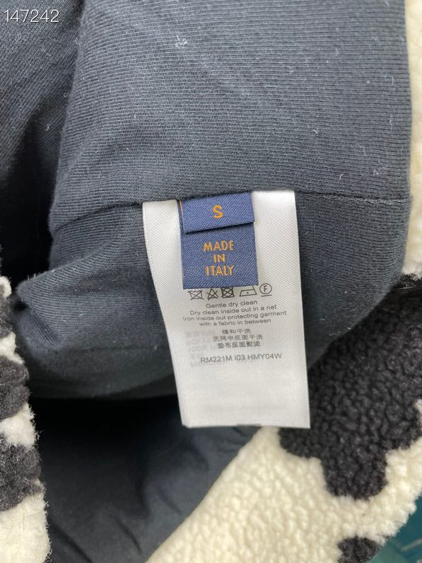 Side profile of Louis Vuitton luxury clothing with signature branding