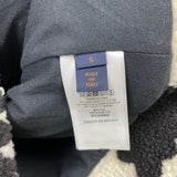 Side profile of Louis Vuitton luxury clothing with signature branding