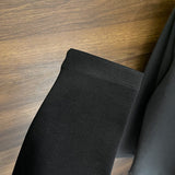 Full styled look of Louis Vuitton luxury clothing with label-forward styling