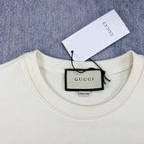Close-up detail shot of Gucci luxury clothing with signature branding