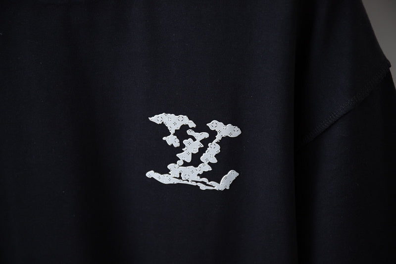 Flat lay presentation of Louis Vuitton cotton t-shirt with monogram-inspired silhouette