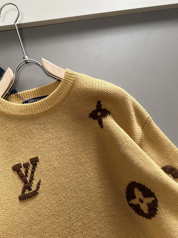 Close-up detail shot of Louis Vuitton luxury clothing with signature branding