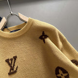 Close-up detail shot of Louis Vuitton luxury clothing with signature branding