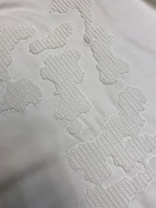 Close-up detail shot of Louis Vuitton luxury clothing with runway-inspired design