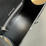 Side profile of classic signature women's handbag – women's designer-style accessory