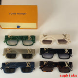 Close-up detail view of Louis Vuitton unisex sunglasses