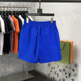 Side profile of Rhude luxury clothing with logo-detail design