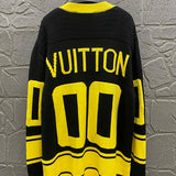 Close-up detail shot of Louis Vuitton luxury clothing with runway-inspired design