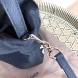 Handle and strap detail of statement sleek women's handbag – women's statement bag