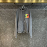 Front view of Louis Vuitton luxury clothing with label-forward styling