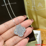 Lifestyle view of Van Cleef & Arpels unisex jewelry piece