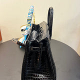 Side view of classic structured handbag