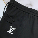 Close-up detail shot of Louis Vuitton cotton t-shirt with label-forward styling